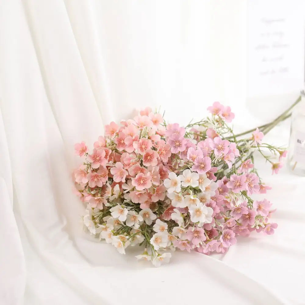 Delicate pink and white artificial flowers baby’s breath wedding bouquet with slender green stems by decorbites imitation flower