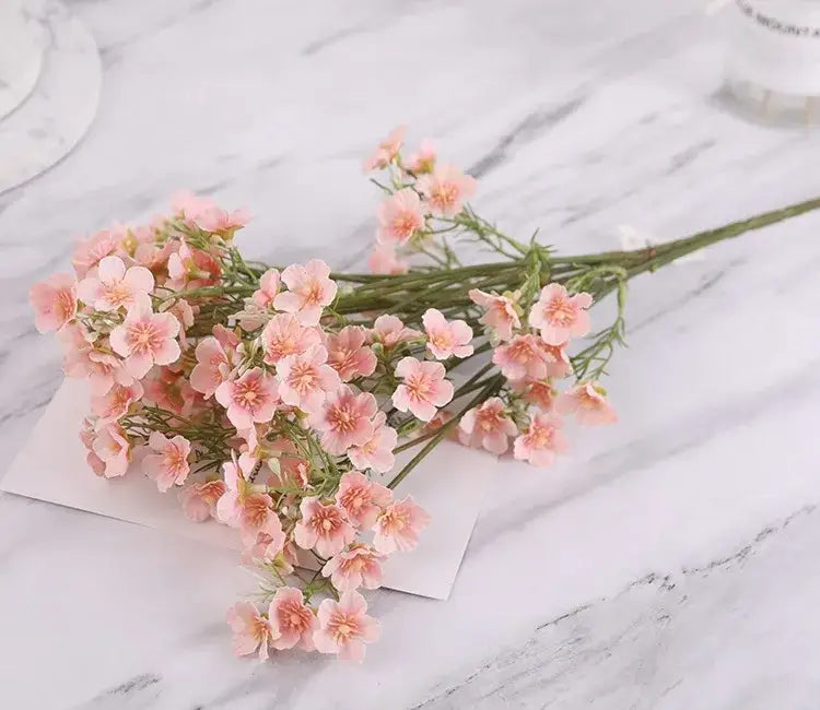 Delicate pink and white artificial flowers baby’s breath wedding bouquet with slender green stems by decorbites imitation flower
