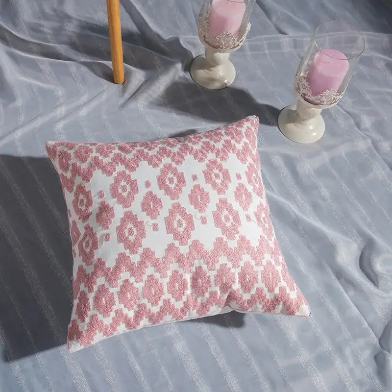 A square cotton flower embroidered pillow with white base and pink floral pattern for living room decorbites decor