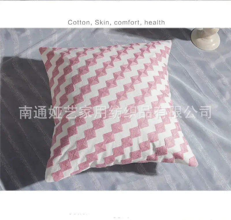 A square cotton flower embroidered pillow with pink geometric zigzag on white base for living room decorbites decor