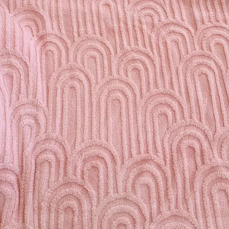 Soft pink double layered flannel plush blanket with textured wave pattern for bedroom quilt use