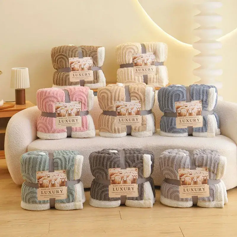 Pink and white double layered flannel plush blanket with ribbed texture and contrasting fleece lining for bedroom use