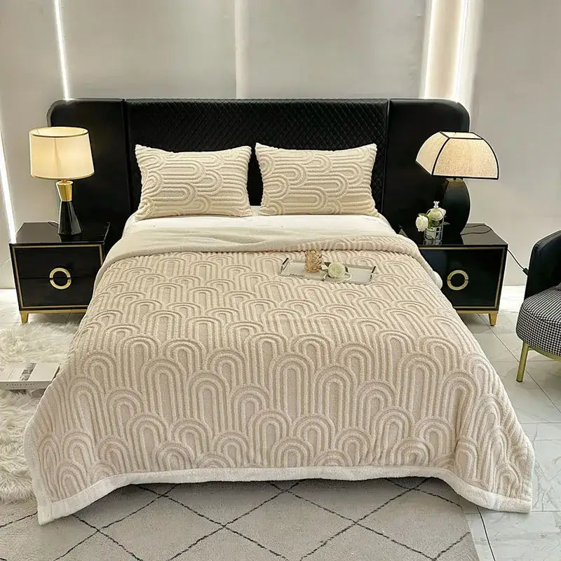 Cream-colored quilted bedroom quilt with raised wave pattern and soft plush texture in double layered flannel arch design