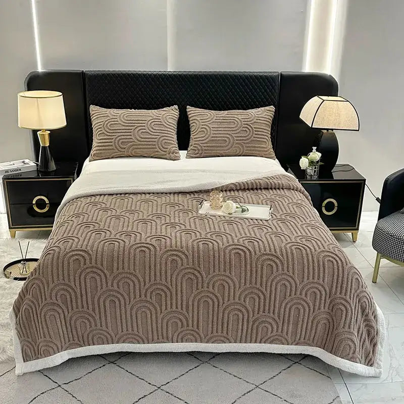 Beige textured quilt with repeating wave pattern and white fleece border in pink and white double layered flannel plush blanket