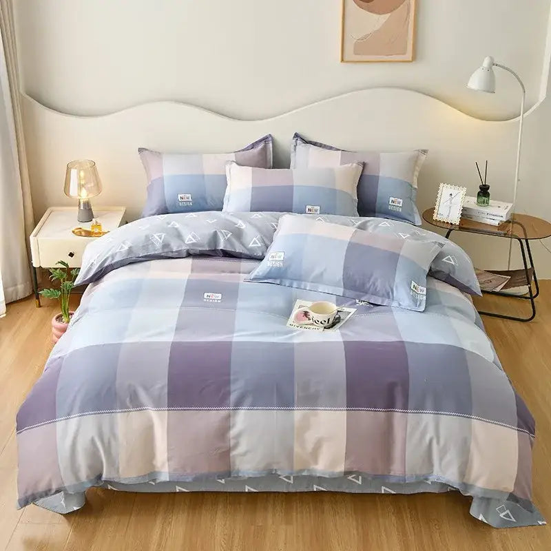 Pastel blue and lavender plaid decorbites cotton printed bedding set with white triangle accents and soft satin finish