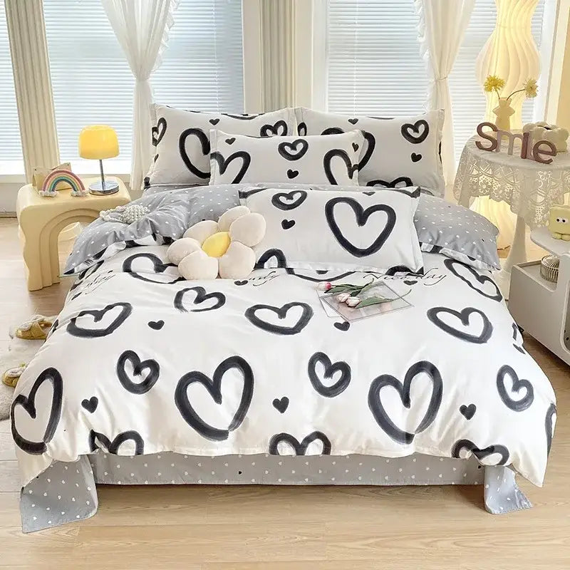 White duvet cover with black heart patterns and gray polka dot trim in decorbites cotton printed bedding set