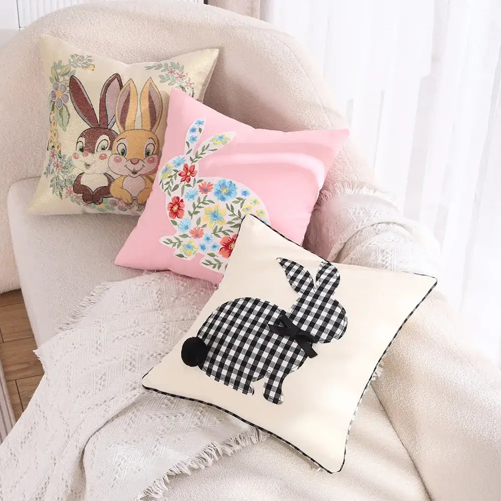 Cream-colored cushion cover with black and white gingham bunny silhouette and black bow for decorbites bunny cushion decor