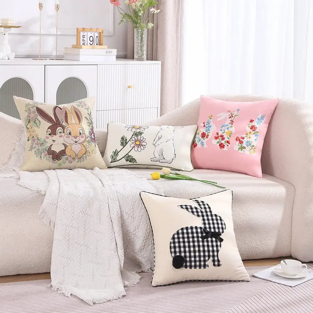 Cream-colored cushion cover with a black and white checkered decorbites bunny and floral embroidery for living room decor