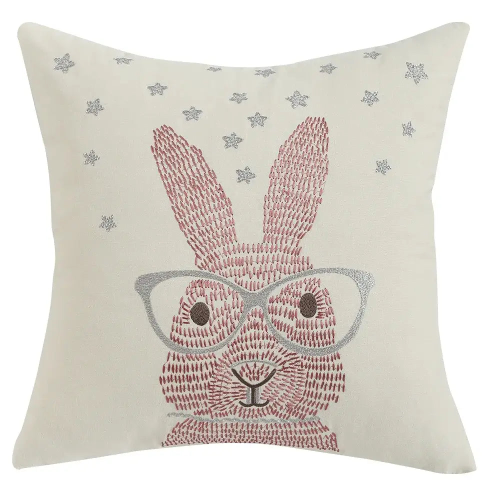 Cream-colored cushion cover with embroidered pink and silver bunny wearing glasses and star motifs for living room decorbites bunny cushion