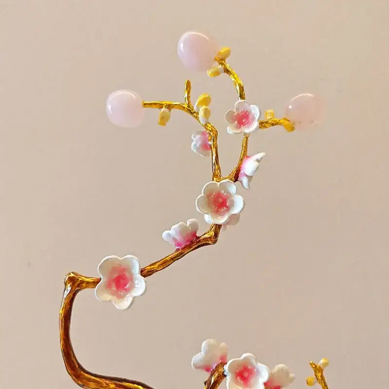Delicate pink and white ceramic blossoms on gold-toned branch with rose quartz beads in decorbites golden tree crystal ball decor