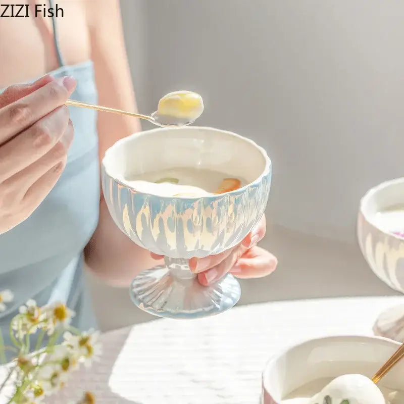 A delicate light blue ceramic dessert bowl with fluted texture and matching base from decorbites gradient gloss collection
