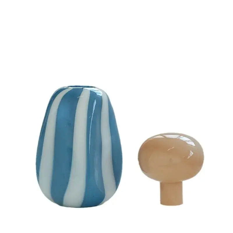 Blue and white striped glass vase with a pink and white striped ceramic vase cover band for living room decor