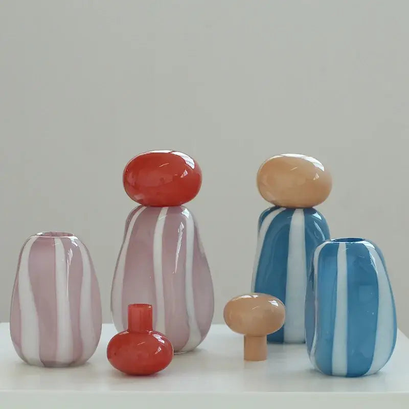 Pink and white striped ceramic vase cover band on pastel-striped glass vases with rounded glossy bodies for decor