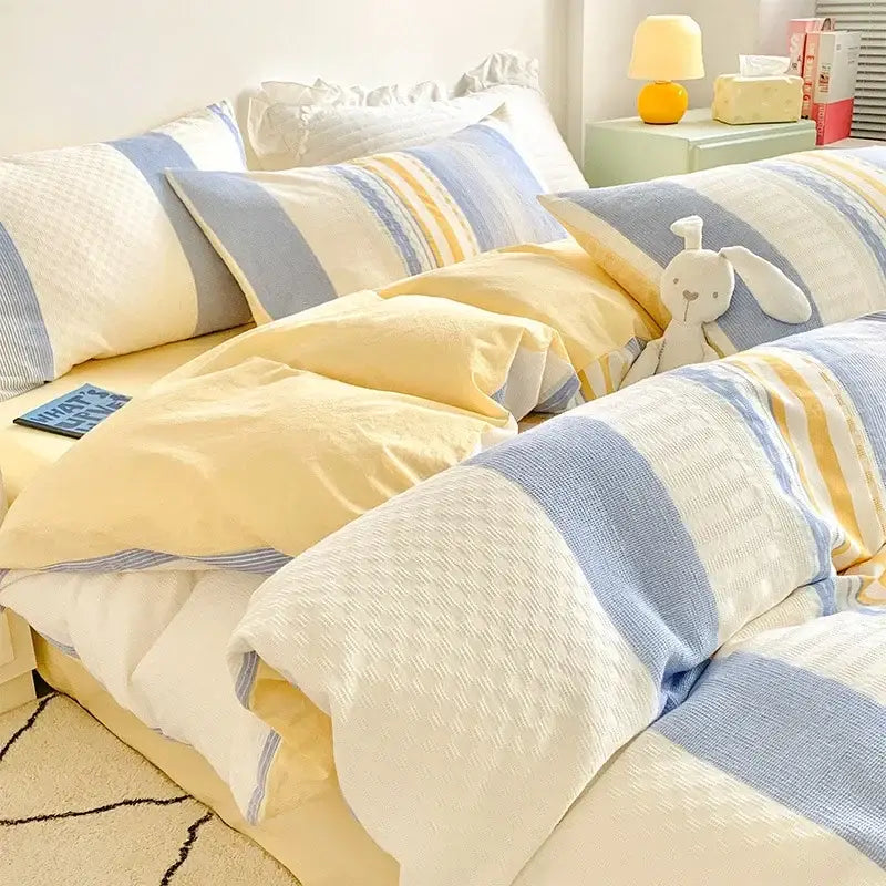 Soft yellow and blue striped bedding set with cozy knit pattern made from decorbites jacquard cotton bedding for bedroom use