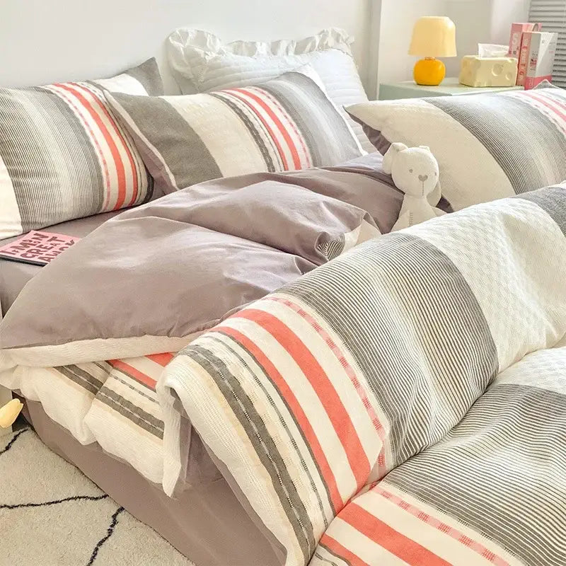 Cozy gray and coral-striped duvet set made of soft decorbites jacquard cotton bedding for elegant bedroom decor