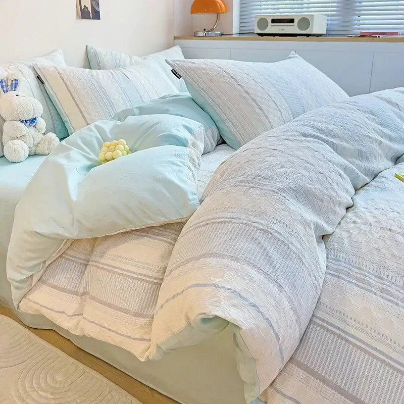 Soft pastel blue and white striped quilted duvet set with cozy textured fabric finish in decorbites jacquard cotton bedding set