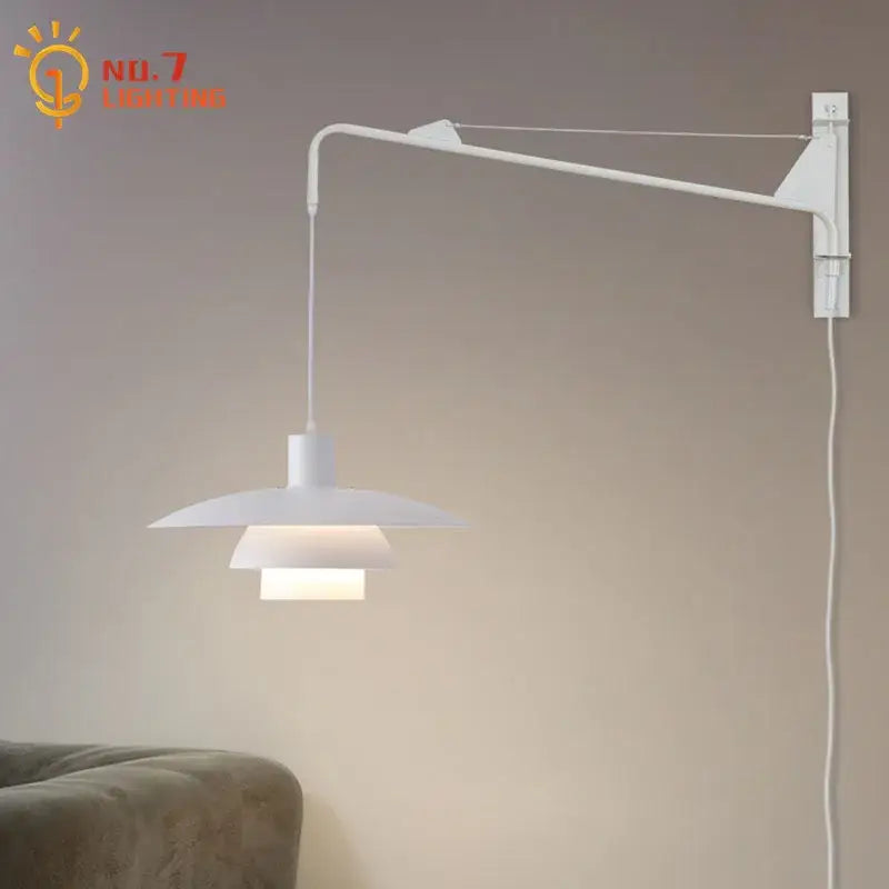 White minimalist wall lamp with swing arm and tiered shade featuring wind rotating mechanism for bedroom use
