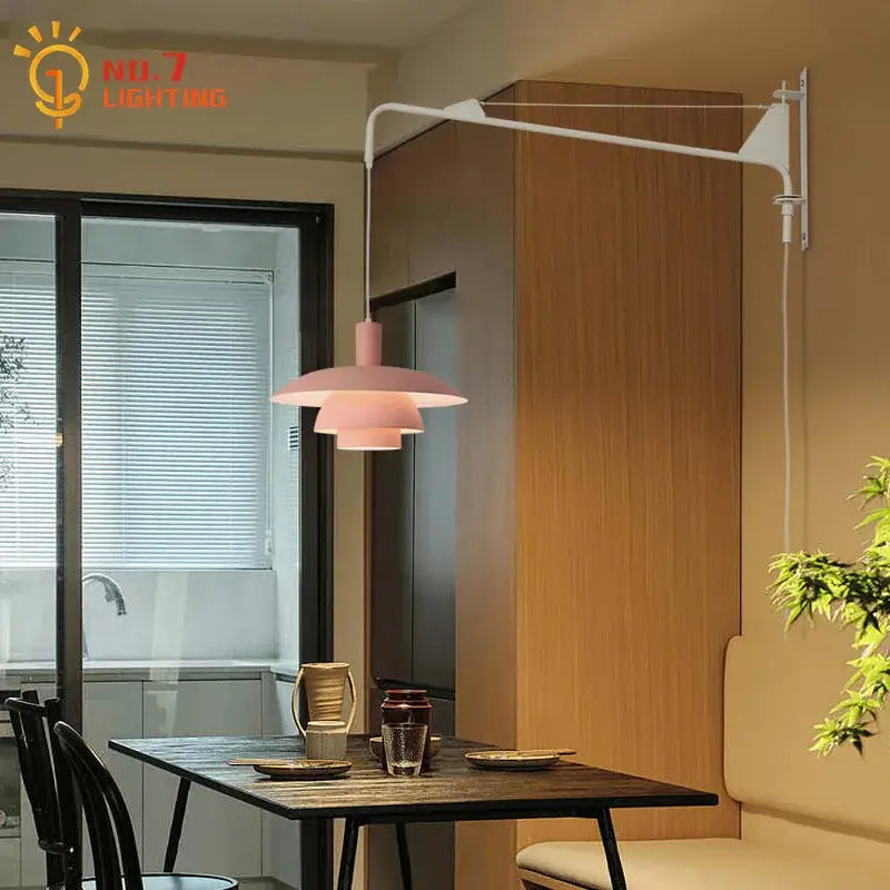 Pink layered pendant wall lamp with sleek white swing arm and wind rotating feature for bedroom lighting