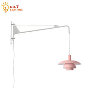 Pink tiered pendant wall lamp with white adjustable swing arm and wind rotating feature for bedroom use