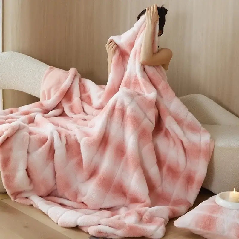 A plush pink and white gradient decorbites cozy fleece blanket with soft fuzzy texture for bedroom throw use