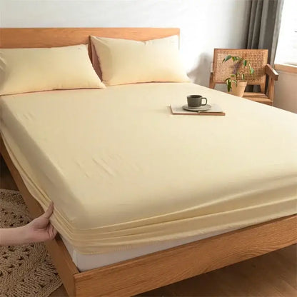 Cream-colored stretchy cotton fitted sheet with smooth texture and elastic edge for decorbites cotton fitted bedding