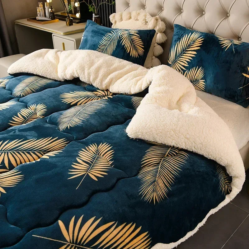 Deep blue quilted super thick warm blanket with golden palm leaf patterns and plush white milk fleece interior