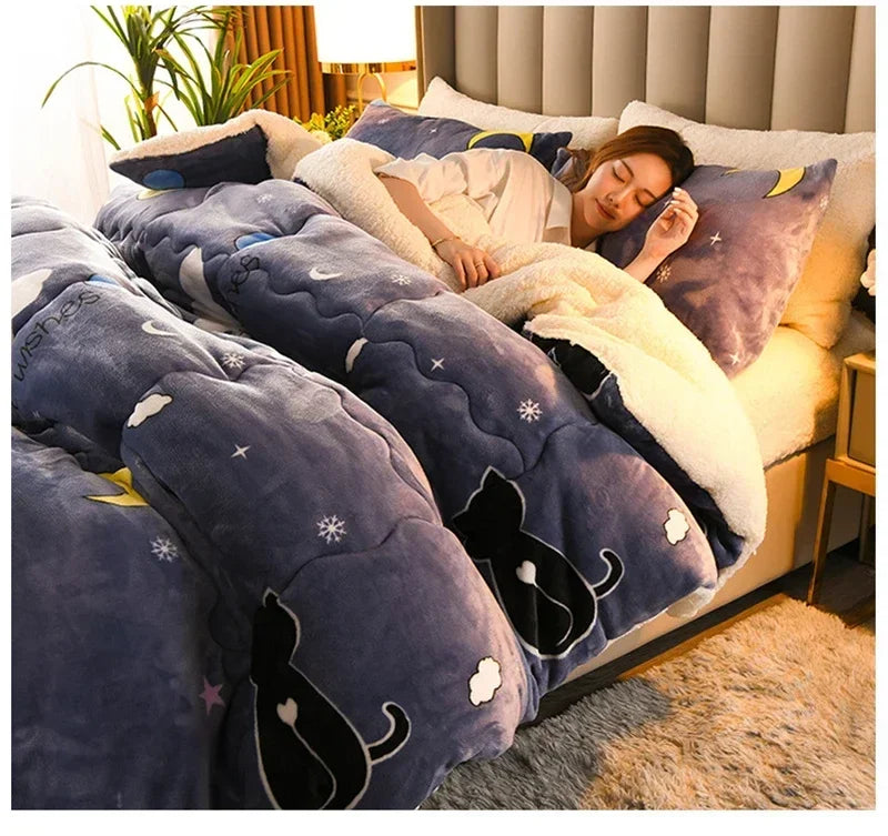 A cozy navy blue plush warm blanket with black cat silhouettes and star patterns and soft white milk fleece lining