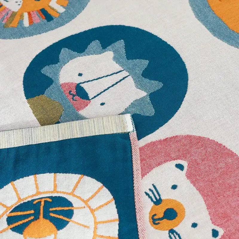 A soft white quick dry cotton bath towel with playful colorful lions and bears pattern for decorbites lions bath use
