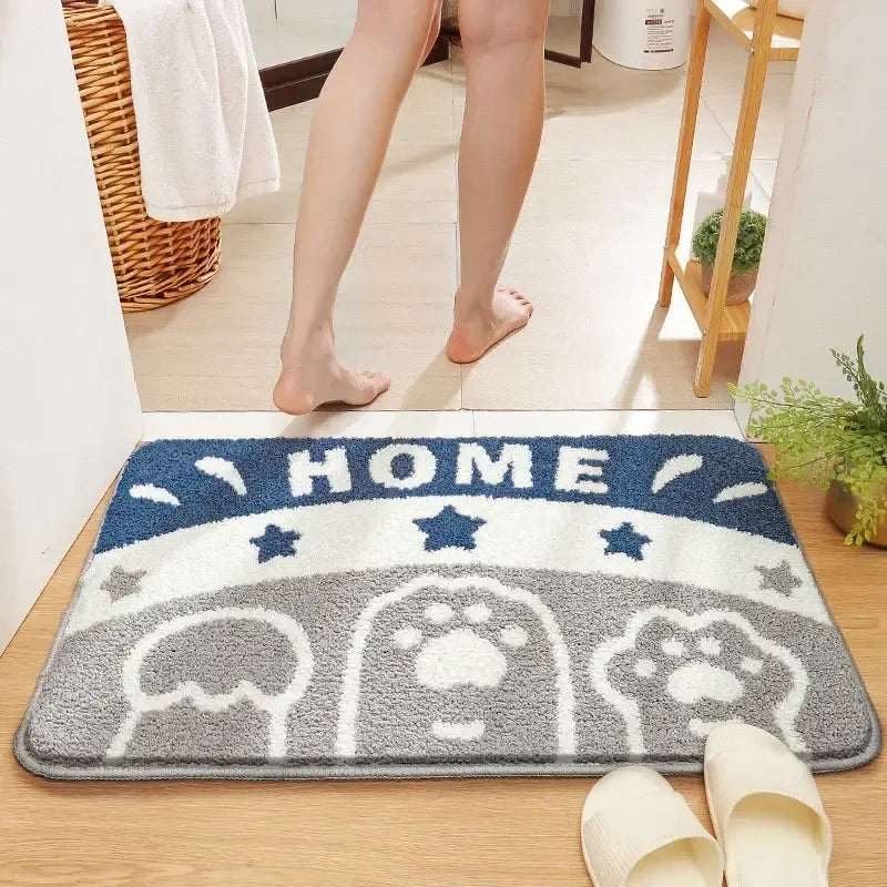 Plush blue white and gray bath rug with home text paw prints and stars featuring decorbites cartoon animal design