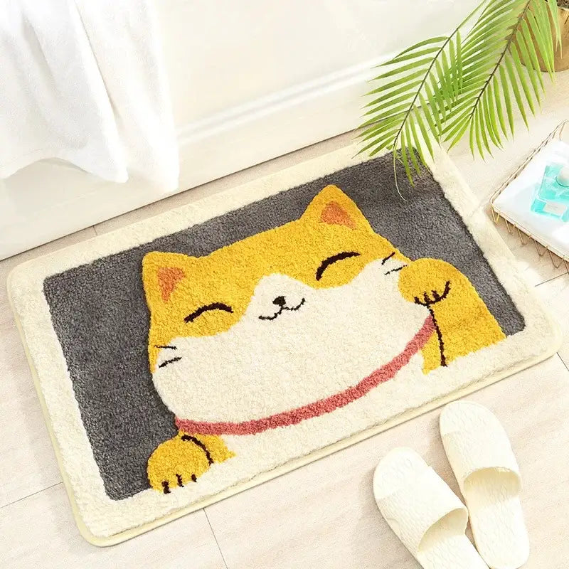 A plush gray bath rug featuring a cheerful yellow and white cartoon animal cat with a red collar for decorbites cartoon animal bathroom decor