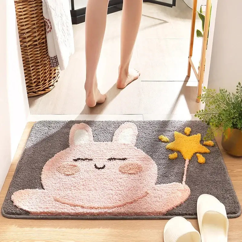 Gray plush bath rug featuring a pink cartoon rabbit holding a yellow star for decorbites cartoon animal bathroom use