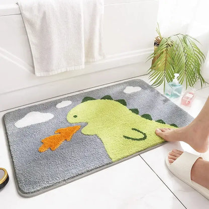 A plush gray bath rug with a bright green dinosaur and white clouds for decorbites cartoon animal bathroom use