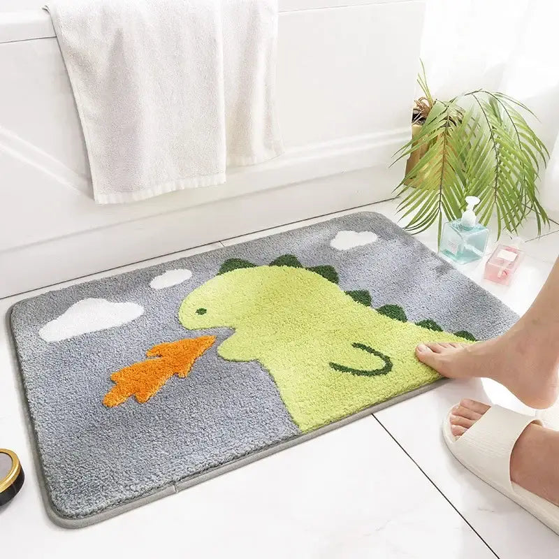 A plush gray bath rug with a bright green dinosaur and white clouds for decorbites cartoon animal bathroom use