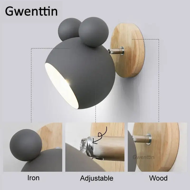 Gray iron wall lamp with whimsical cartoon mouse design, adjustable head, on wood base for kids bedroom decorbites cartoon mouse