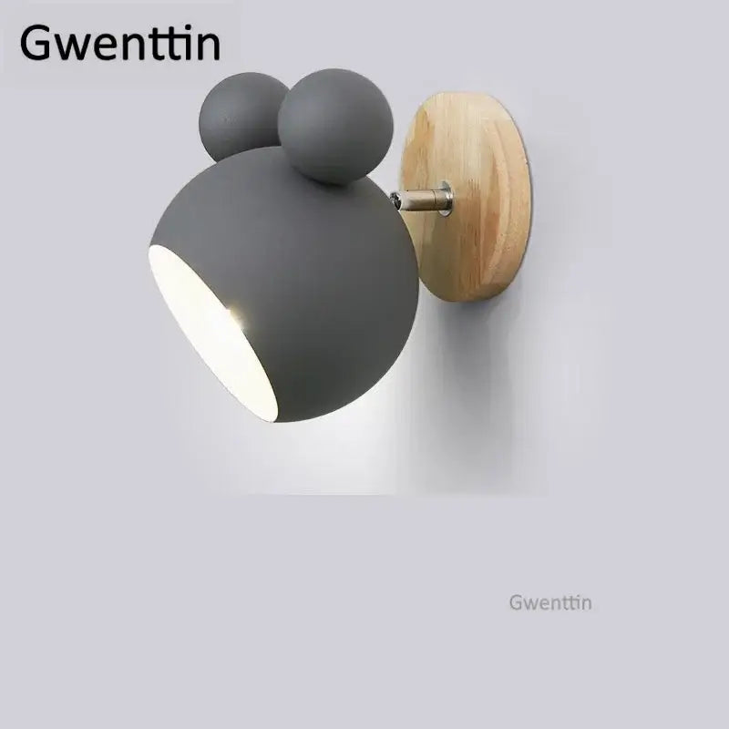 Gray matte-finished wall lamp with whimsical rounded head and two ears on natural wood base decorbites cartoon mouse wall