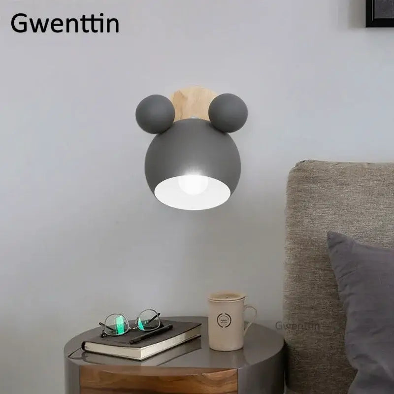 Gray cartoon mouse wall lamp with wooden ears and matte finish by decorbites for playful kids bedroom decor