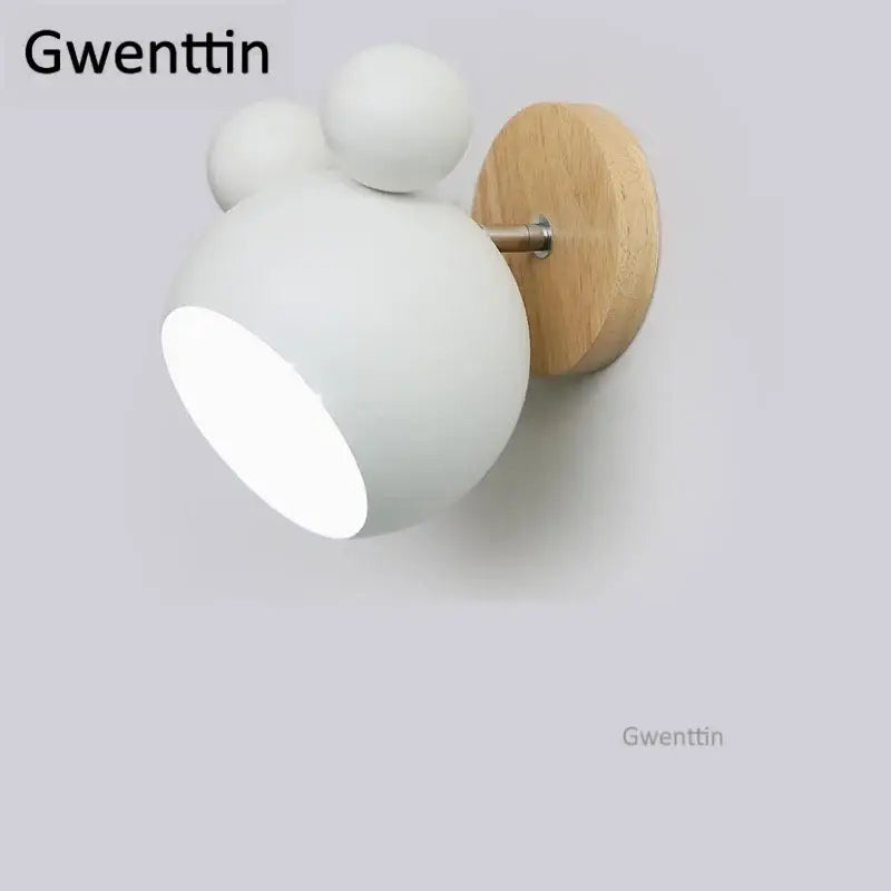 White matte wall lamp with wooden circular backplate and two spherical accents in decorbites cartoon mouse style