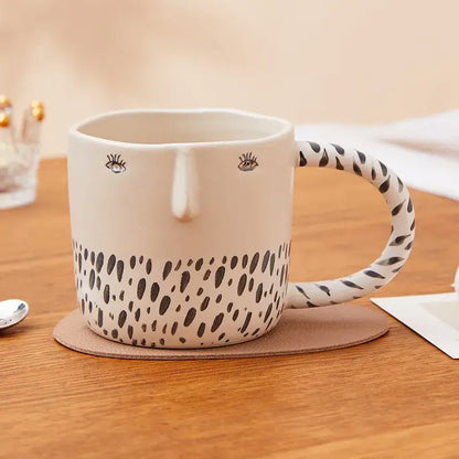 Cream-colored 340ml ceramic coffee milk mug with black spotted pattern and embroidered eyes for kitchen decor