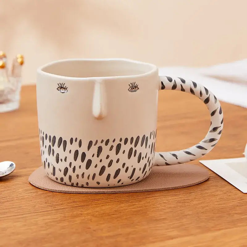 Cream-colored 340ml ceramic coffee milk mug with black spotted pattern and embroidered eyes for kitchen decor