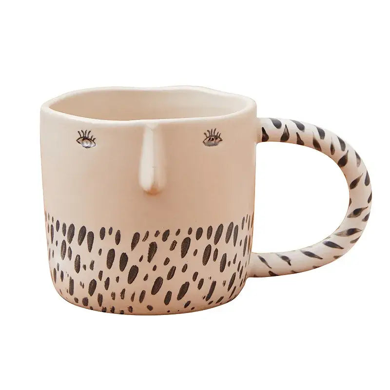 Cream-colored 340ml ceramic coffee milk mug with black eye and dot patterns for kitchen decor and coffee milk use