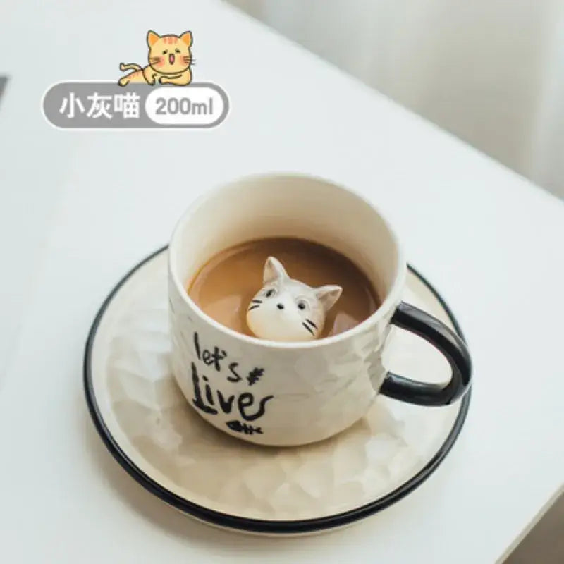 Playful white and black ceramic cup with cat claw handle and cat figurine floating in coffee decorbites cat claw mug