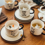 Playful white and black cat claw ceramic cup with sculpted kitten figurine inside by decorbites cat claw ceramic mug