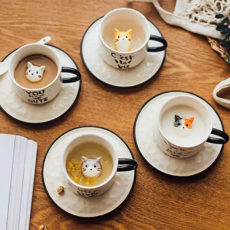 Playful white and black cat claw ceramic cup featuring a small floating cat figurine by decorbites cat claw