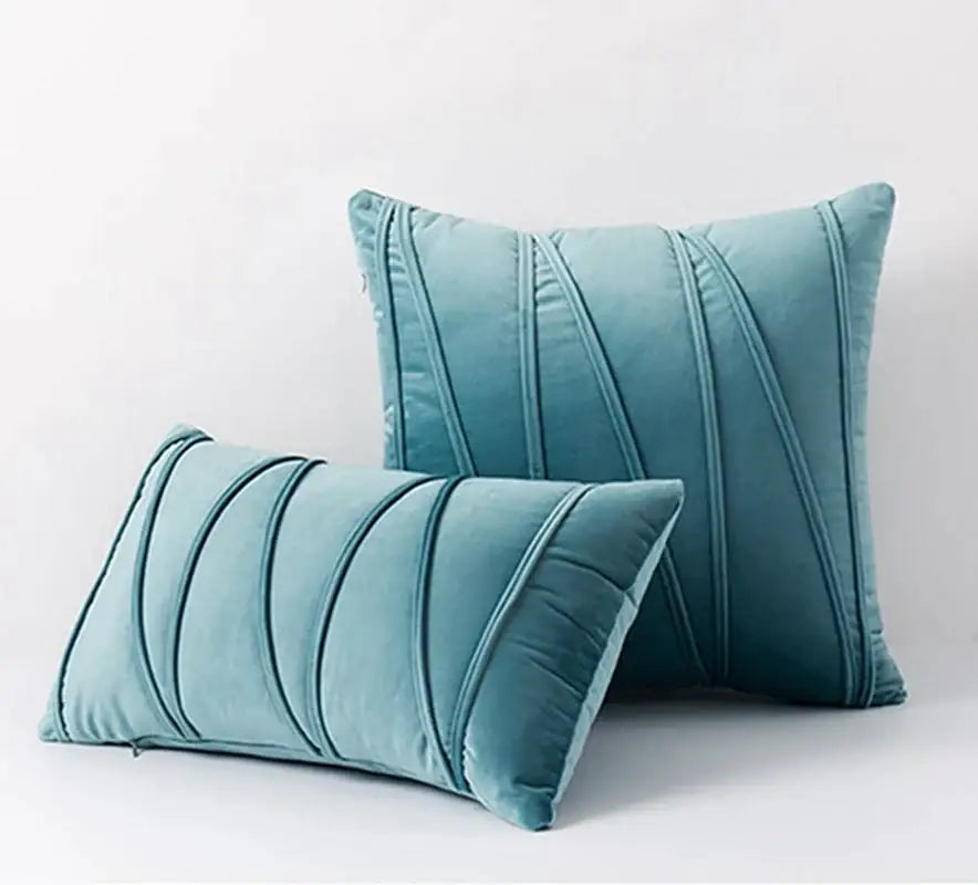 Teal velvet throw pillows with stitched vertical pleats complement pleated mustard yellow short wool velvet living room decorbites knit short