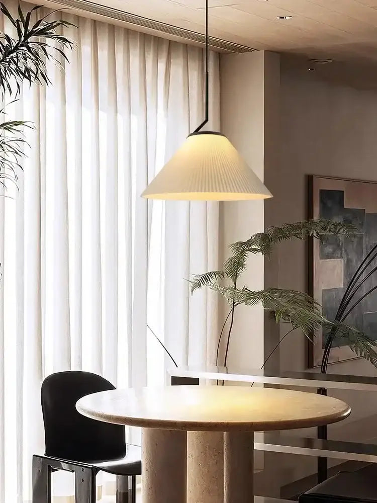 A modern pendant light with a cream pleated fabric shade and black metal frame ideal for dining room decorbites cream led