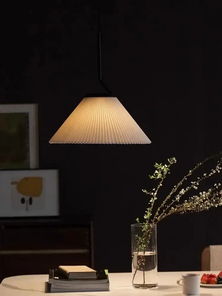 A warm-toned pleated paper pendant light with black rod for dining room decorbites cream led chandelier