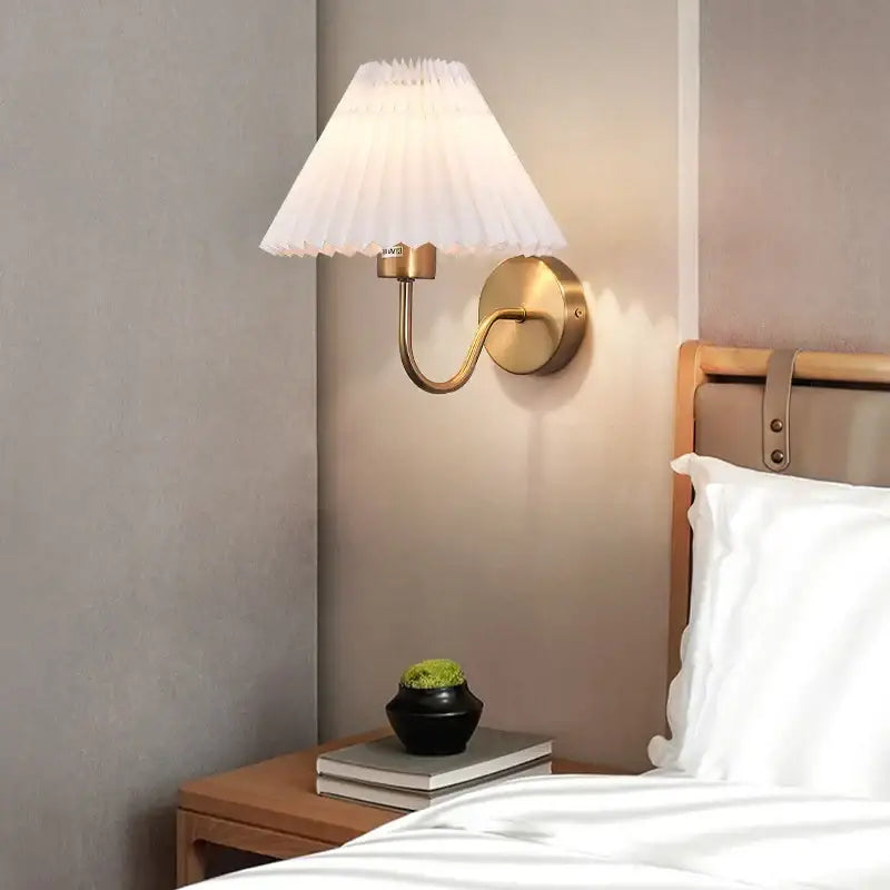 Pleated white cloth lampshade led wall lamp with brass finish by decorbites ideal for bedroom and living room decor