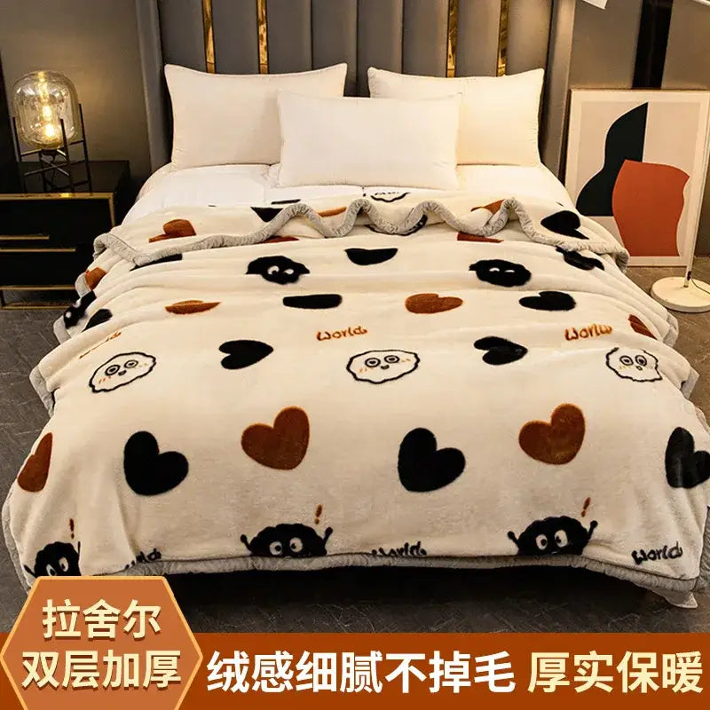 Cream-colored raschel blanket with black and brown heart patterns cartoon faces and world text for winter decorbites use