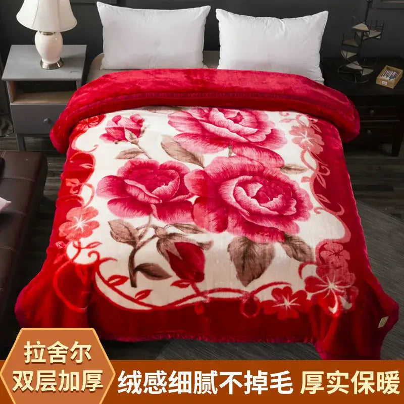 A plush red and cream floral embroidered raschel blanket with soft fuzzy texture perfect for winter decorbites winter raschel