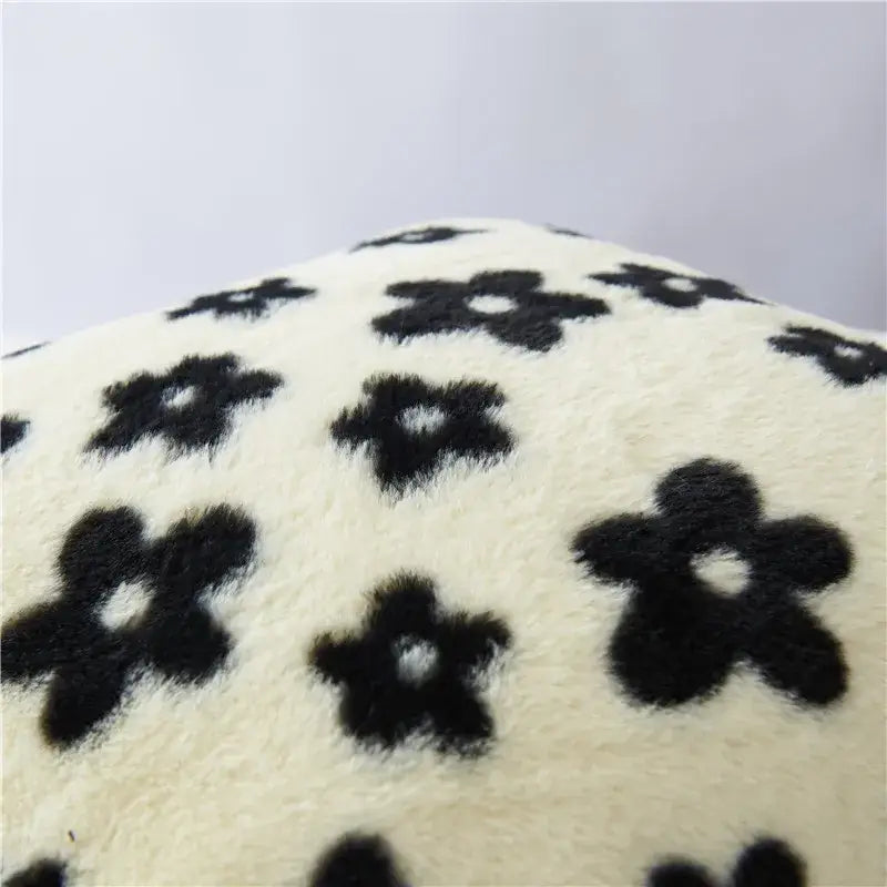 Cream-colored plush cushion cover with black white flower pattern for living room decor by decorbites black white